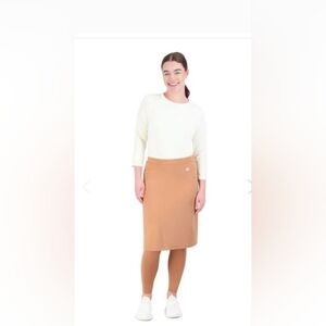 Snoga tan skirt with ankle length leggings. 22" length.
